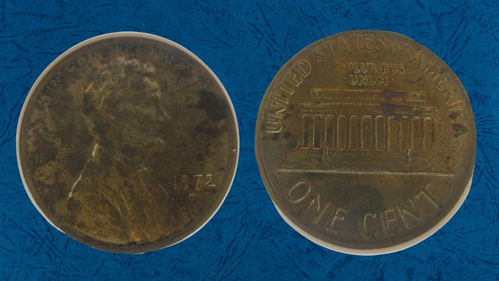 1972 penny struck on wrong dime planchet shown next to a normal 1972 copper penny for size and color comparison